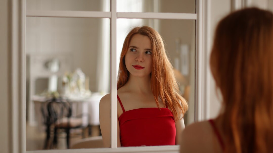 woman practicing spanish pronunciation in mirror