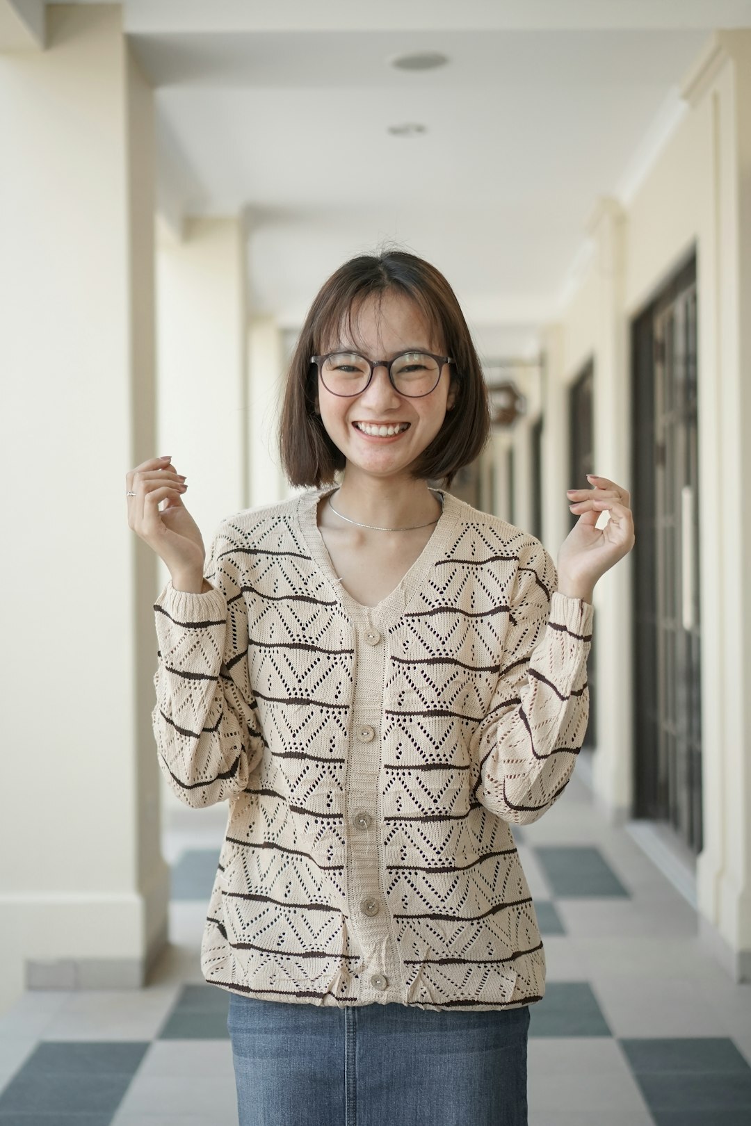 Portrait of a friendly speech coach in a cardigan